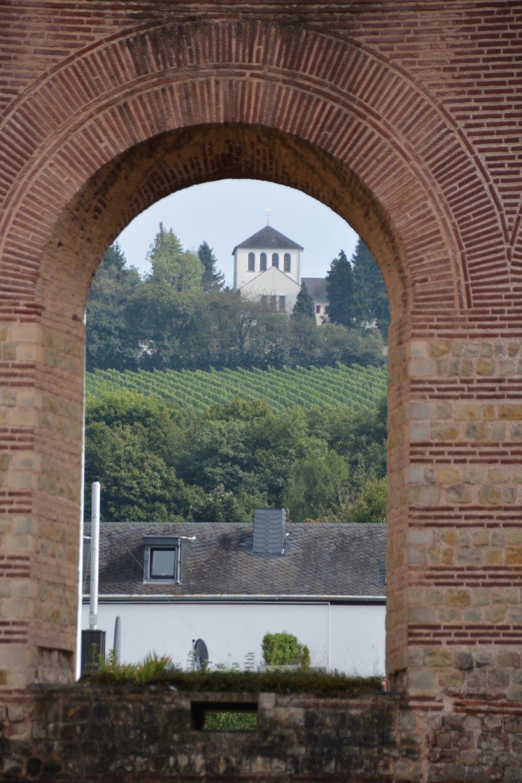 Winery seen through an arch in the Imperial Baths